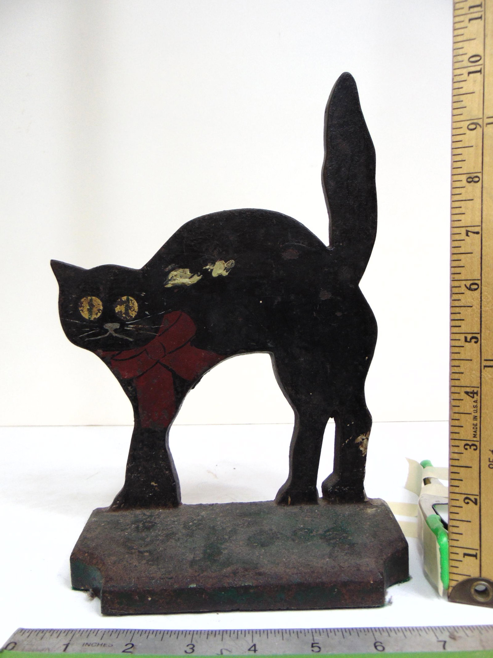 Iron cat doorstop, flat, with painted bow collar, base is 7", height is 11 3/8" (1 of 4)
