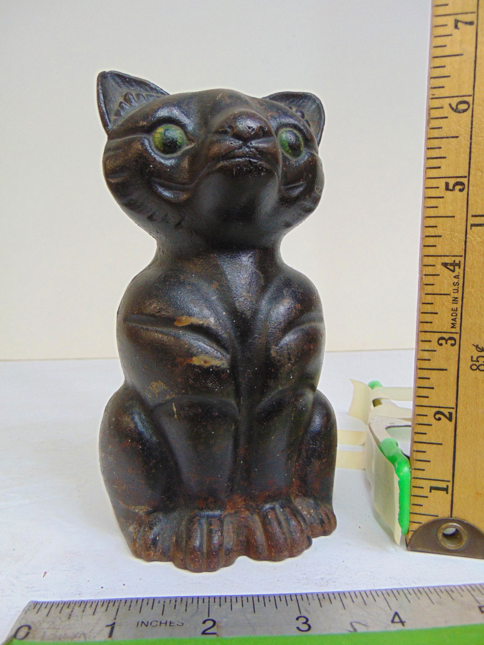 Cast iron Cat doorstop, in black with green eyes, height is 6 7/8": Cast iron Cat doorstop, in black with green eyes, height is 6 7/8"