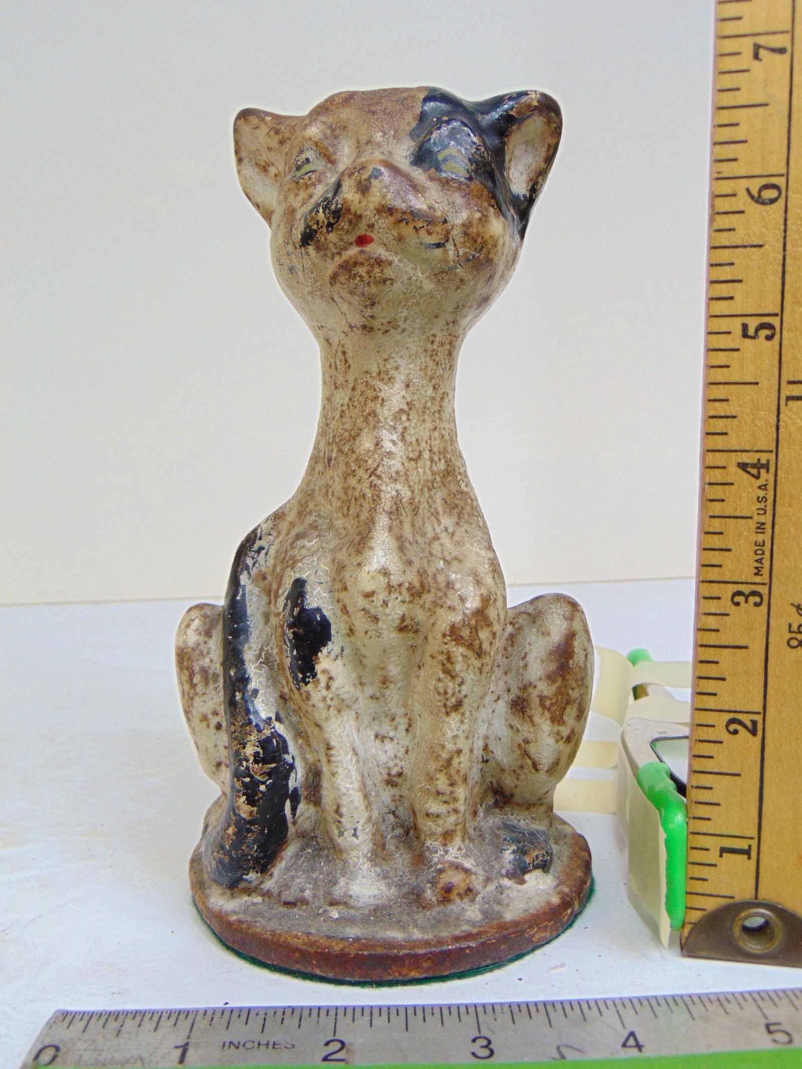 Solid iron doorstop, white cat, partially black face, heavy, cat is 7" tall: Solid iron doorstop, white cat, partially black face, heavy, cat is 7" tall