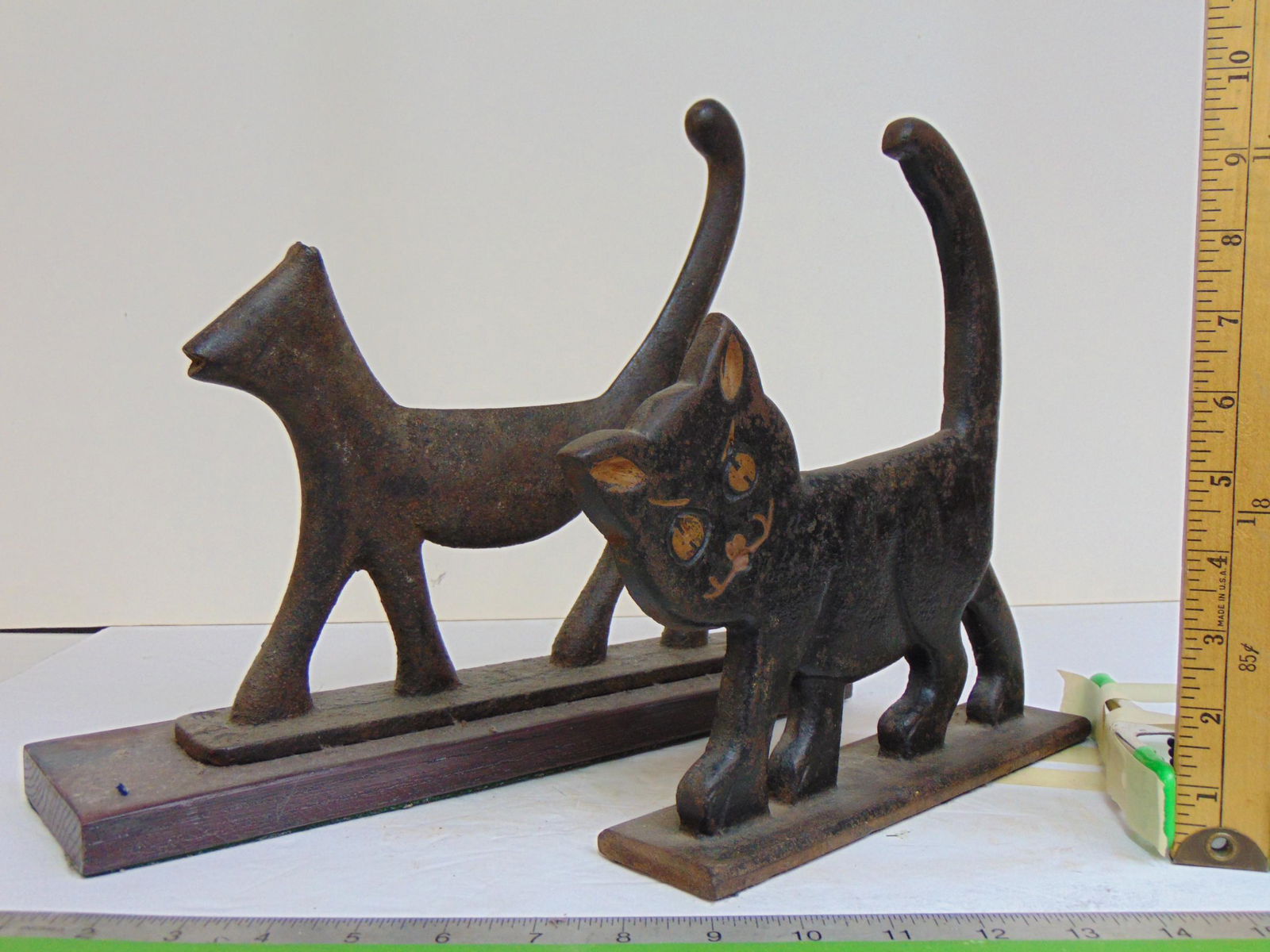 2 cast iron cat boot scrapers, both walking cats, one mounted on wood base, height is 10 3/8" & (1 of 8)