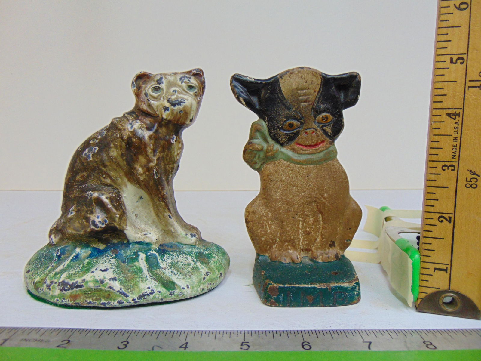 Two small cast iron dog doorstops, one is signed & dated 1921, both original paint (1 of 6)