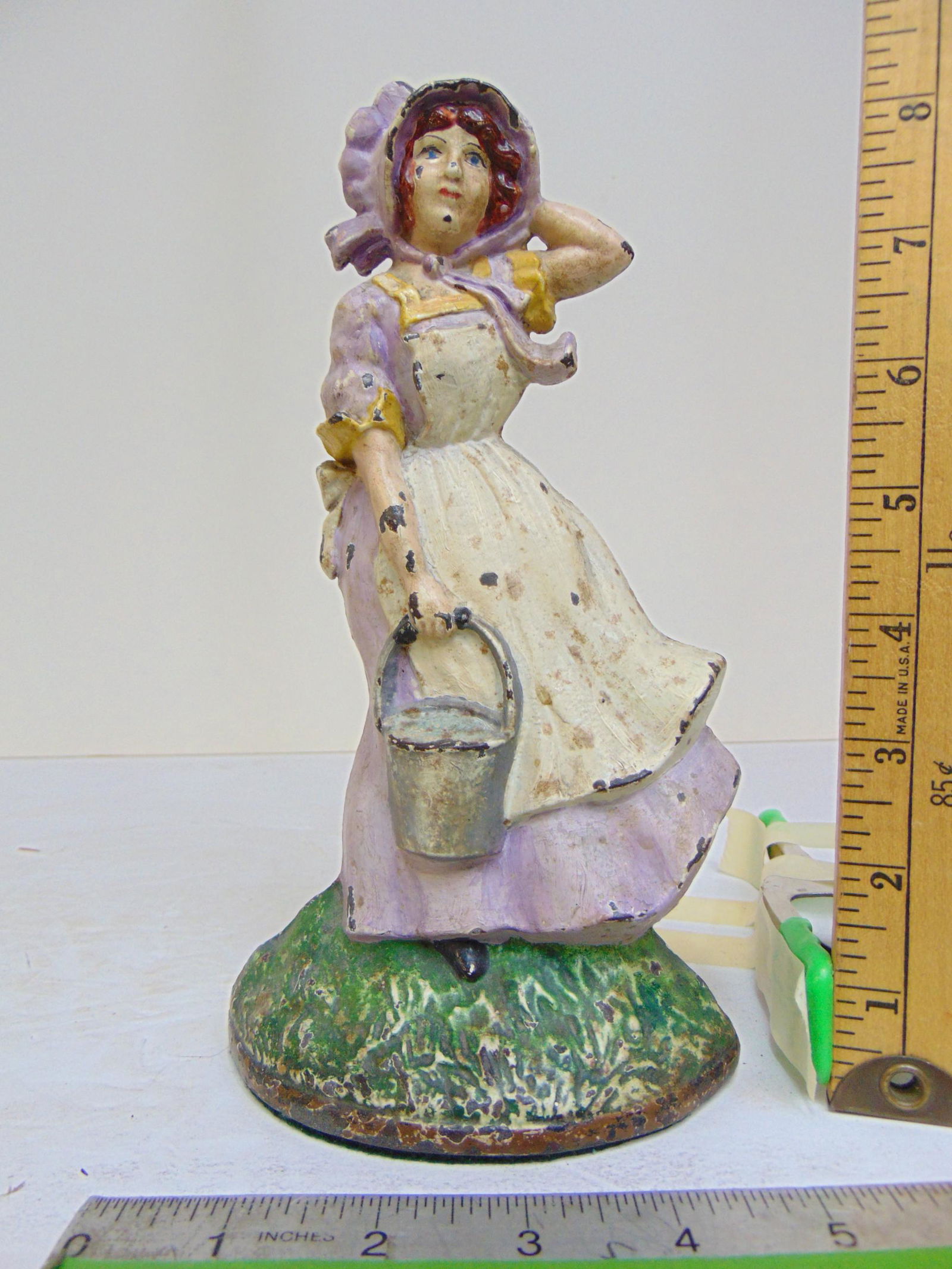 Cast iron doorstop, girl with pail, bonnet, height is 8.75", # 288 on back (1 of 6)