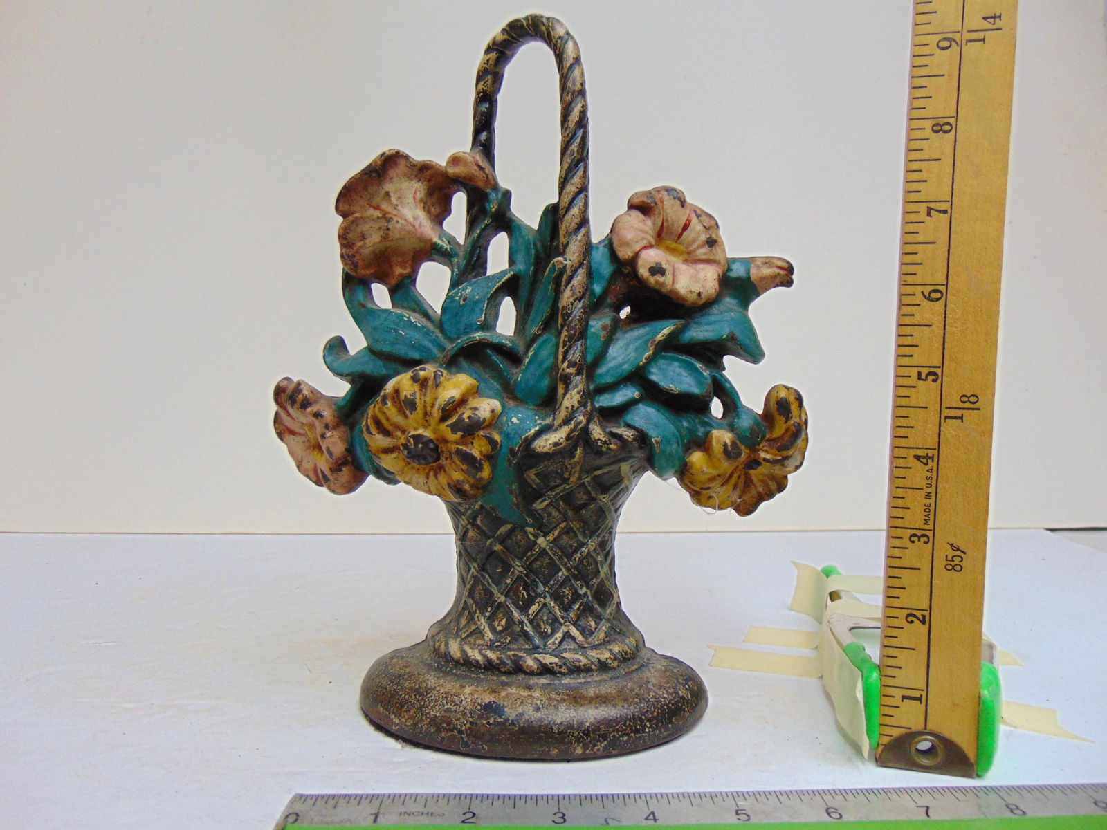 Cast iron flower basket doorstop, height is 9.75": Cast iron flower basket doorstop, height is 9.75"