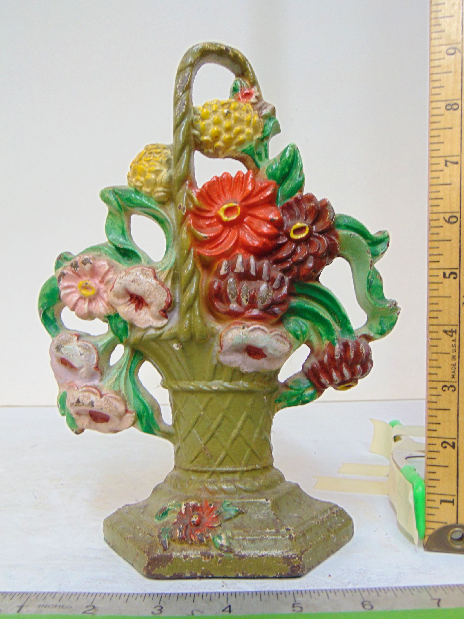 Cast iron flower basket doorstop, height is 9 3/8": Cast iron flower basket doorstop, height is 9 3/8"
