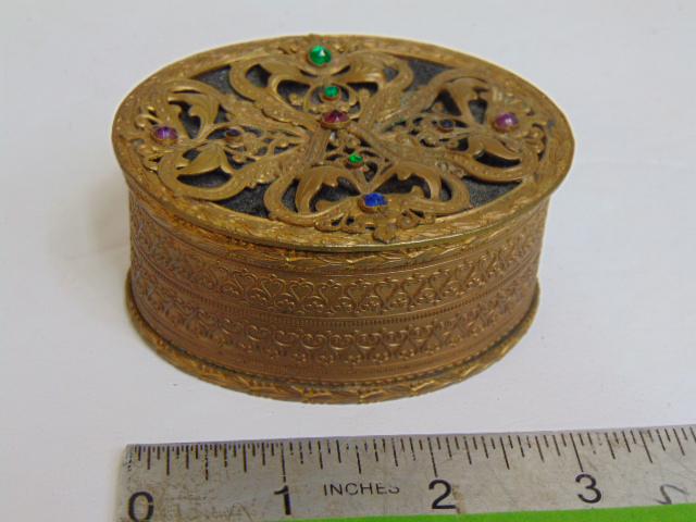 Antique Austrian jeweled trinket box, with filigree design, applied jewels and black velvet: Antique Austrian jeweled trinket box, with filigree design, applied jewels and black velvet interior, 3" by 2.25", height is 1.5"