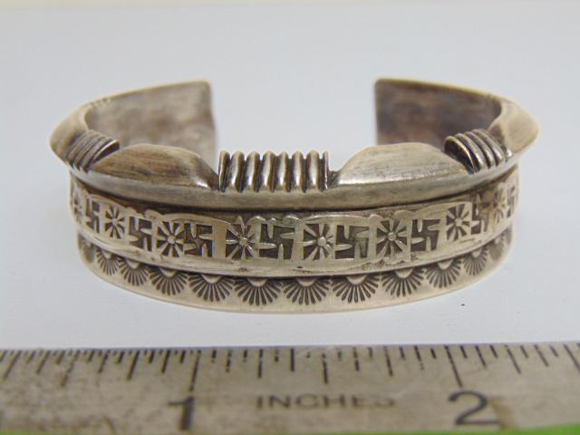 Jewelry. Navajo sterling cuff/bracelet three different stampwork design sections; 63.18 grams; 3/4" (1 of 4)