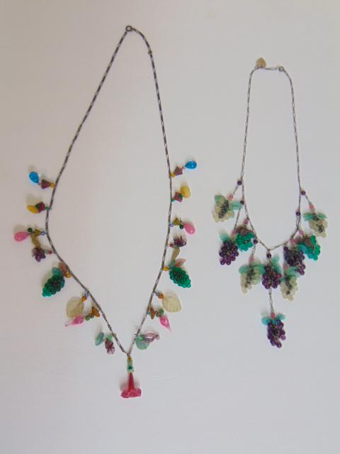 Jewelry. (2) Vintage Lucy Isaacs necklaces, pink tulip flower glass necklace 15" length, purple: Jewelry. (2) Vintage Lucy Isaacs necklaces, pink tulip flower glass necklace 15" length, purple grape glass necklace 12" length with tag, tulip necklace no tag, both in good condition