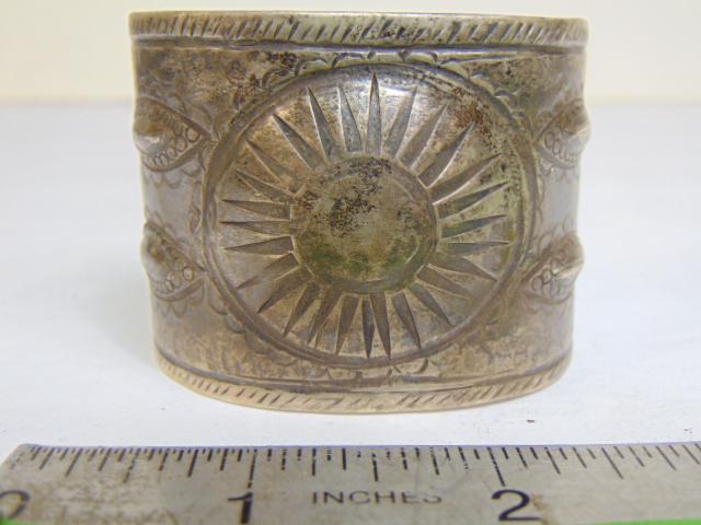 Jewelry. Navajo old pawn wide sterling cuff/bracelet, "sunburst" central design, stampwork, 2" wide, (1 of 4)