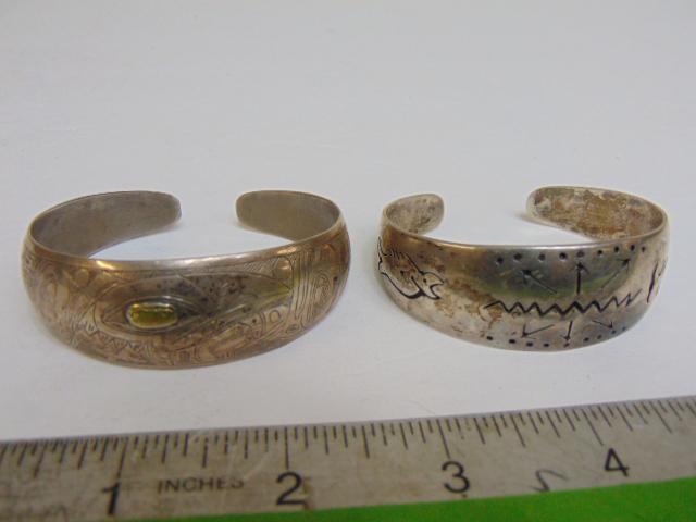 Jewelry. Navajo old pawn (2) sterling cuffs, both concave design, 48.60 grams total weight, cuff w/ (1 of 4)