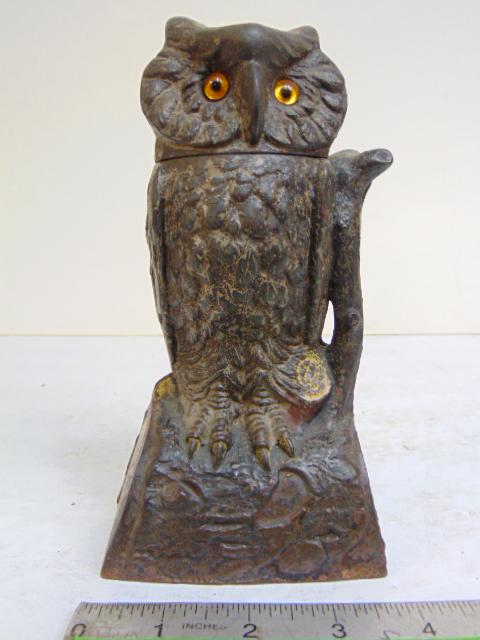 Cast iron owl bank, owl rotated head, old paint, glass eyes, patent 1880, height is 7.25" (1 of 7)