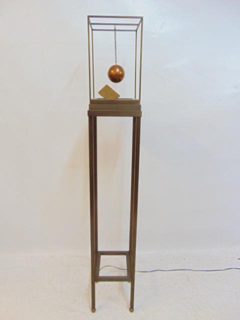 Contemporary bronze sculpture, Lisa Waters, "Suspended Ball", when plugged in the disc at the base, (1 of 6)