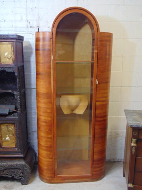 Cherry case, cabinet with sculpture, by Jonah Meyer, China cabinet style cabinet with rounded sides: Cherry case, cabinet with sculpture, by Jonah Meyer, China cabinet style cabinet with rounded sides & top with glass shelves & sculpture in center, cabinet is 77.75" tall.