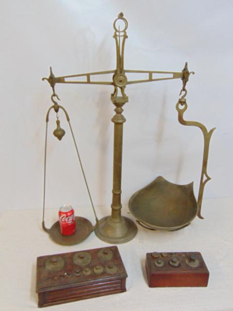 Large brass balance scale with 2 sets of weights, scale is 33.5" tall, includes two sets of weights (1 of 6)