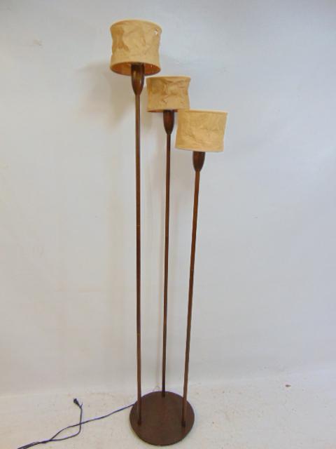 Triple pole mid Century style floor lamp, painted metal with faux wood appearance, each pole has: Triple pole mid Century style floor lamp, painted metal with faux wood appearance, each pole has small crumpled paper shade, height is 76"