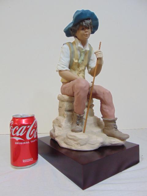 Lladro figure, boy with staff seated on rock, by Sanisidro, No 86, on base, height is 13.5" (1 of 5)