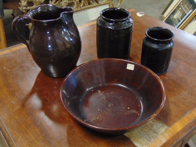4 pieces of brown & redware, pitcher, two jars, brown glazed milk bowl with heart feet (1 of 6)