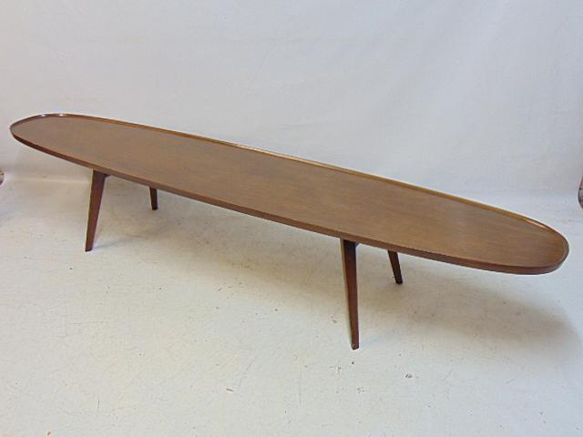 Edward Wormley for Dunbar surfboard coffee table, raised edge, labeled, top is 83.75" by 17", height: Edward Wormley for Dunbar surfboard coffee table, raised edge, labeled, top is 83.75" by 17", height is 15.5", few minor blemishes on edge, see images.