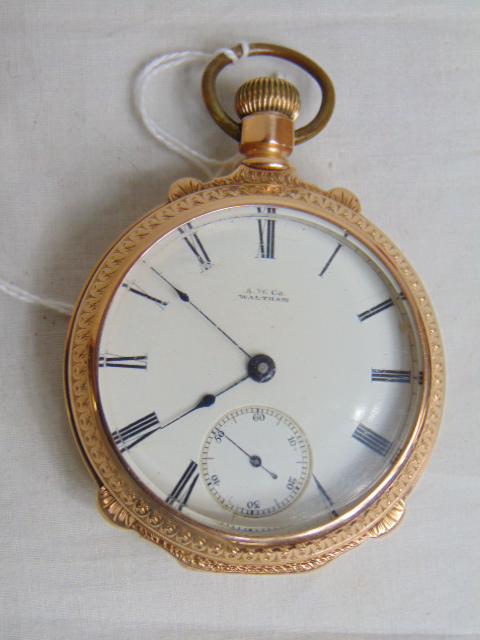 Jewelry. Antique 14kt Waltham pocket watch; A.W. co; open face pocket watch; 141.46 grams; white: Jewelry. Antique 14kt Waltham pocket watch; A.W. co; open face pocket watch; 141.46 grams; white porcelain dial; watch face has some scratches, nice decorated case, warranted 14K. Interior cover is en