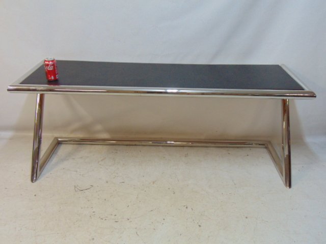 Chrome base textured top console table, "Z" style tubular chrome base with pressed board top, textur: Chrome base textured top console table, "Z" style tubular chrome base with pressed board top, textured laminate finish, in black, table is 65.75" long, depth is 20", height is 26"