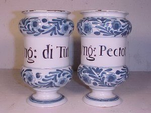 Pair of blue & white apothecary jars: Pair of apothecary jars "Ving: di Tutie," glaze wear on rim, small chip on base & "Ving: Pectoral", minor glaze wear on rim, 8.25" tall, 5" wide. Note: This unique collection of 18th & 19th Century ap