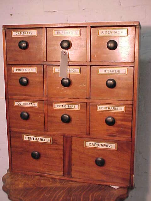 Early English apothecary cabinet, 11 drawers: Early English apothecary cabinet with 11 drawers, configured with 9 small drawers over two large drawers, labels in good condition, case clean, might have been refinished at one point, case has a cher