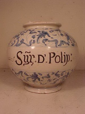 Rounded apothecary jar "Syr d'Polip": Rounded apothecary jar "Syr d'Polip" 8" x 9", blue & white decoration with black letters. This piece has minor chips on the edge of the base, and one moderate chip on the top rim (see detail image) No