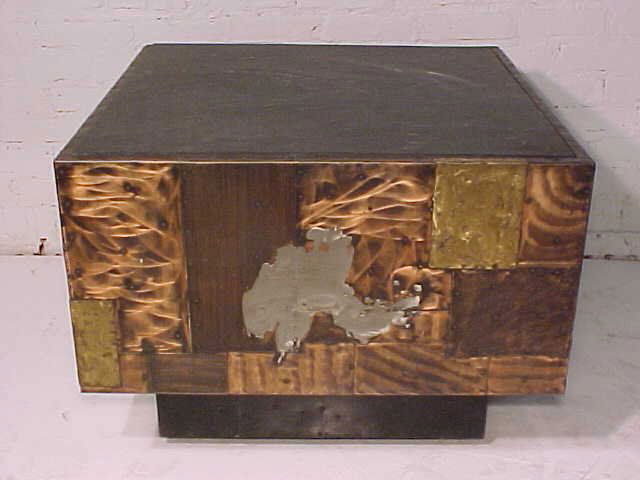 Slate top table on mixed metal base by Paul Evans: Rare slate top table on mixed metal base by Paul Evans, table measures 29.75" by 29.75" and is 22" high. The height includes the added height of the wheels that the table it sitting on. Slate in good