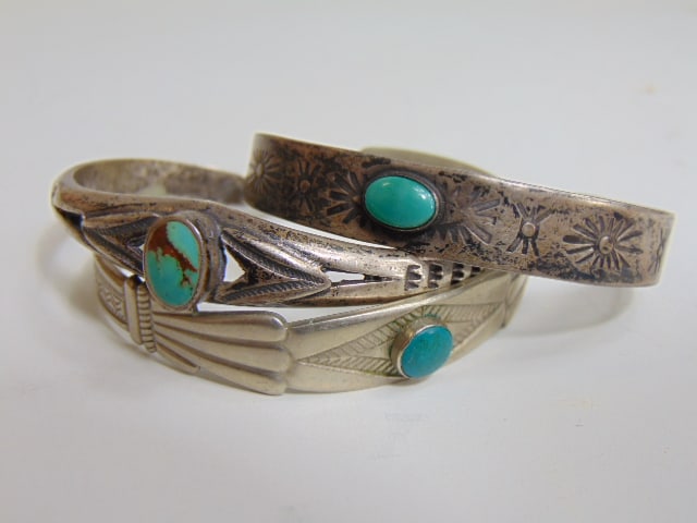 Jewelry. (3) Native American cuffs coin silver cuff w/ small oval green turquoise; sterling cuff w/ (1 of 4)