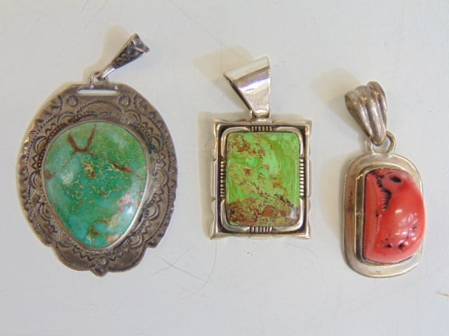 Jewelry. (3) Large sterling silver pendants to include large turquoise w/ stampwork; large coral (1 of 4)