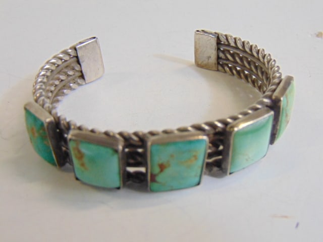 Jewelry. Turquoise sterling silver cuff/bracelet, five square set stones w/ open work twist design. (1 of 4)