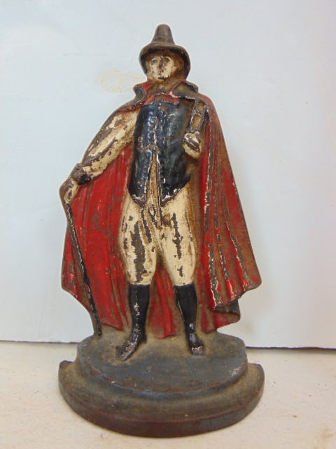 cast iron doorstop, man with cape, cane, height is 7.25": cast iron doorstop, man with cape, cane, height is 7.25"