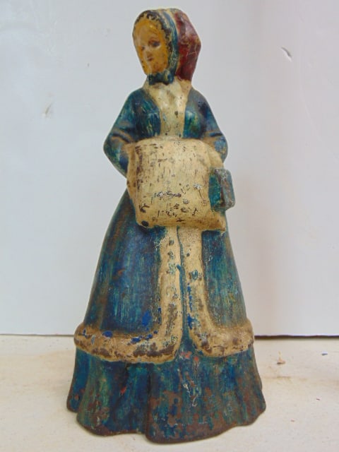 Figural cast iron doorstop, lady with bonnet, hands in muff, Albany Foundry, no marks, height is 9 (1 of 3)