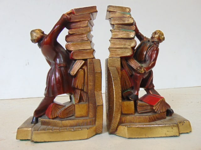 Pair copper clad bookends, figure stacking books, scholar or librarian attempting to secure a (1 of 6)