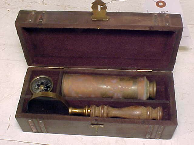 Copper telescope with compass & magnifying glass: Copper telescope with compass & magnifying glass, no name, in wooden case. Case measures 9" long. Hudson Valley Auctioneers has endeavored to accurately describe all items being sold, but all property