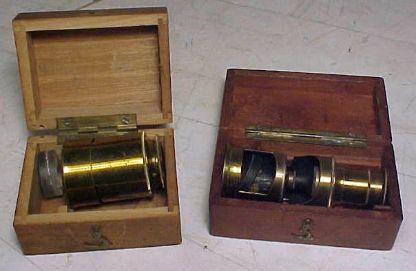 Two pocket microscopes in box,: Two small pocket microscopes in box, box doubles as base. Hudson Valley Auctioneers has endeavored to accurately describe all items being sold, but all property herein offered for sale is strictly "as