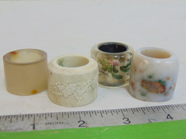 4 Chinese archer rings, porcelain, glass, Jade, glass ring has paint decorated silver (?) center (1 of 11)