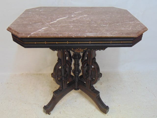 Victorian Eastlake marble top table, carved ebonized base with gilt highlights top is 33.5" by 24", (1 of 5)