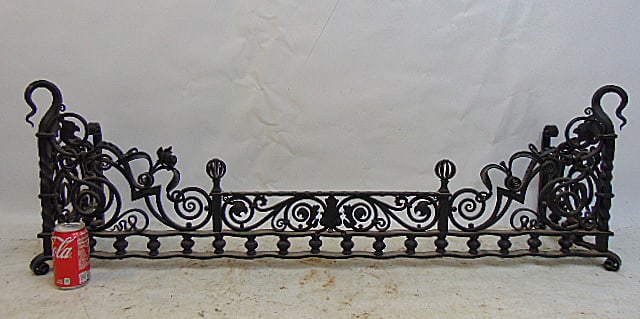 Exceptional wrought iron fireplace fender, decorated with dragons, flowers (one missing), curls,: Exceptional wrought iron fireplace fender, decorated with dragons, flowers (one missing), curls, fender is 16.5" tall, 52" long, 12.5" deep.