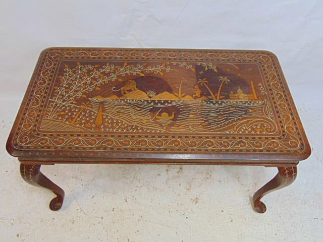 Indian inlaid coffee table with lion hunt scene, top is 36" by 20", height is 18.25", comes with a (1 of 6)