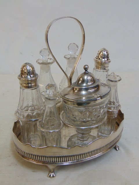 Old Sheffield castor or cruet set, late 18th Century, with original bottles, one stopper is broken.: Old Sheffield castor or cruet set, late 18th Century, with original bottles, one stopper is broken.