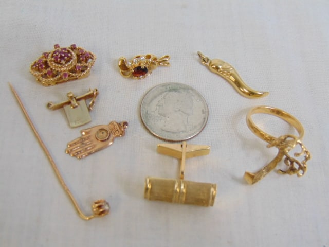 Jewerly. Collection of misc gold to include single cufflink; ruby 14k clasp; rosegold hand pendent; (1 of 3)