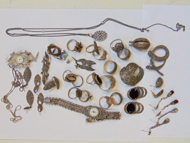 Collection of sterling rings and sterling marcasite jewelry, some earring posts bent: Collection of sterling rings and sterling marcasite jewelry, some earring posts bent