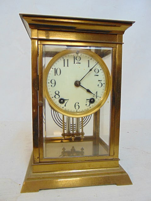 Crystal regulator by Ansonia Clock Co. brass case, faux mercury pendulum, case is 6.5" by 5.5",: Crystal regulator by Ansonia Clock Co. brass case, faux mercury pendulum, case is 6.5" by 5.5", height is 10", brass is pitted