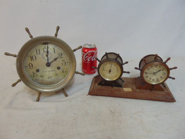 2 Nautical clocks, Seth Thomas ships bell clock with ship wheel case & Waterbury clock barometer: 2 Nautical clocks, Seth Thomas ships bell clock with ship wheel case & Waterbury clock barometer combo, Seth Thomas clock is 7", Waterbury combo is 10 5/8" by 4 1/8", height is 5 6/8",