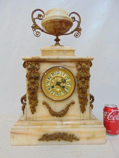 French alabaster or onyx mantle clock with bronze mounted decorations, urn finial, clock is 14" by: French alabaster or onyx mantle clock with bronze mounted decorations, urn finial, clock is 14" by 6", height is 21.25", no key, bell loose, untested