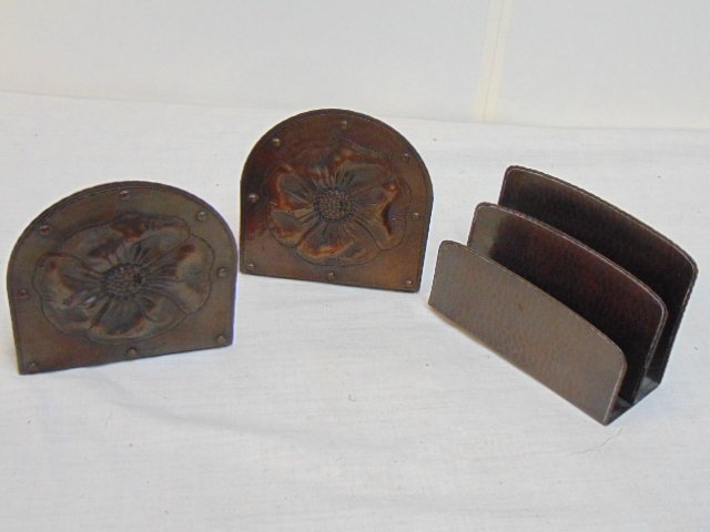 Roycroft hammered copper letter holder & book ends, bookends floral decorated, both signed, letter h: Roycroft hammered copper letter holder & book ends, bookends floral decorated, both signed, letter holder is 5.75" wide, 4" tall, bookends are 5" wide, 5" tall.