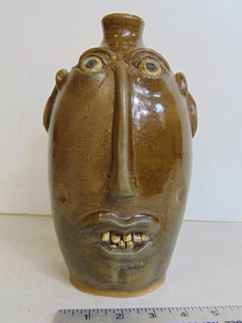 Face jug by Henry Freeman, long nose, dimpled cheeks. 1990, height is 9.5", in good condition. (1 of 6)