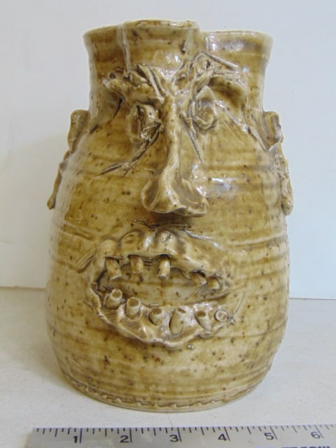 Face pitcher, signed W.T. McLennan, Hollytree Ala. dated 1991, in good condition, height is 8.75" (1 of 5)