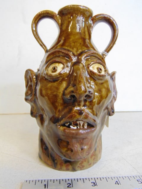 Face jug with double handles, signed illegible (see images), glazed terra cotta, height is 8" (1 of 6)