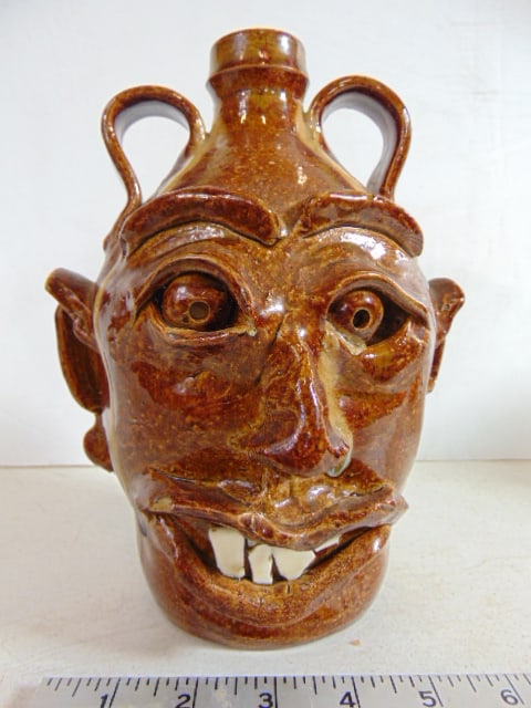 Face jug by A. Teague, in brown glazed terra cotta, height is 9", in good condition. (1 of 6)